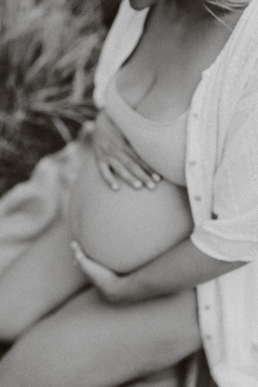 blurred close up of pregnant ladies belly