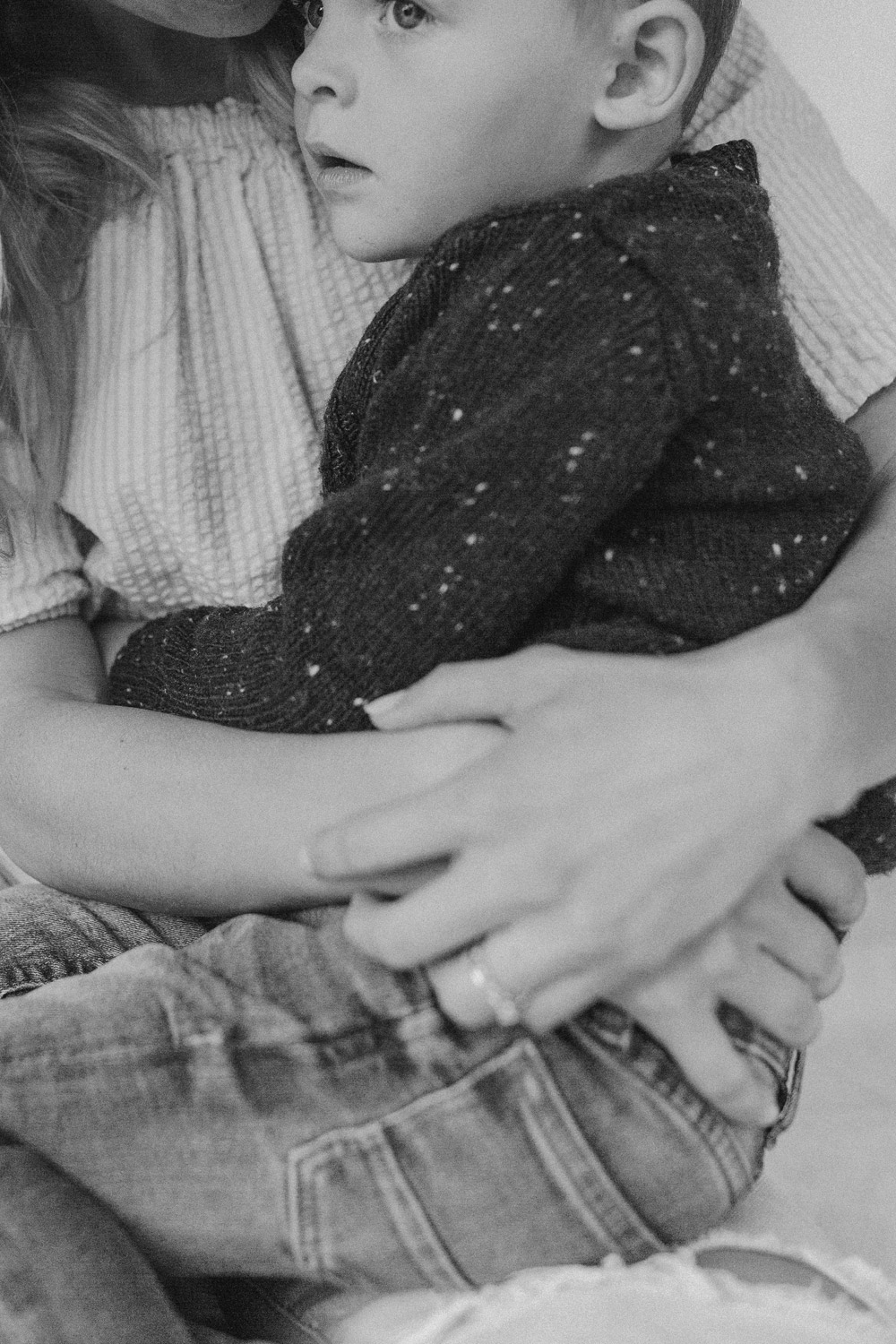 Close up photo of a mum cuddling her son